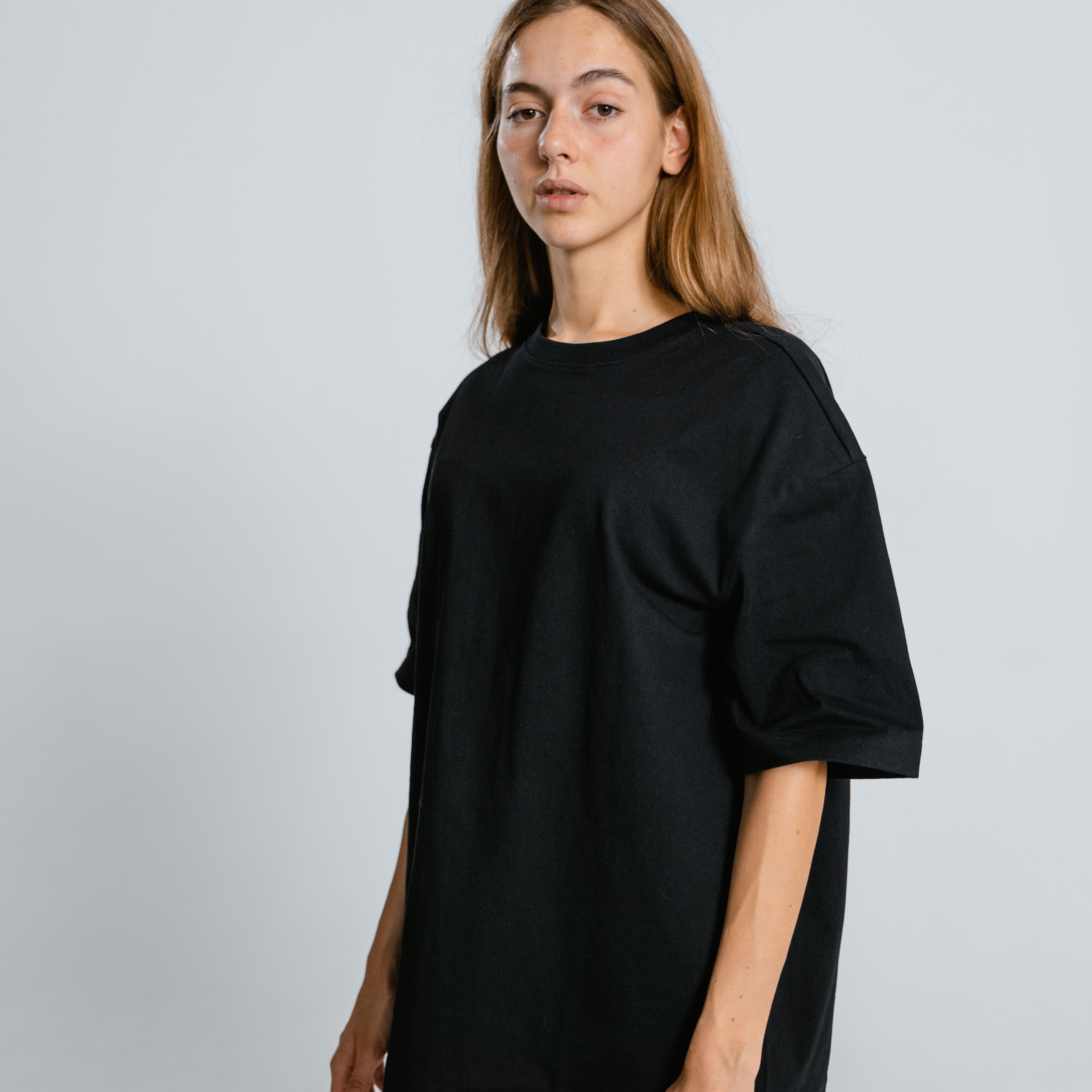 A clean studio product image of a classic round-neck cotton T-shirt displayed on a plain background. Show the T-shirt from the front with its regular fit, short sleeves and smooth cotton fabric. Create separate images for available colors where possible.